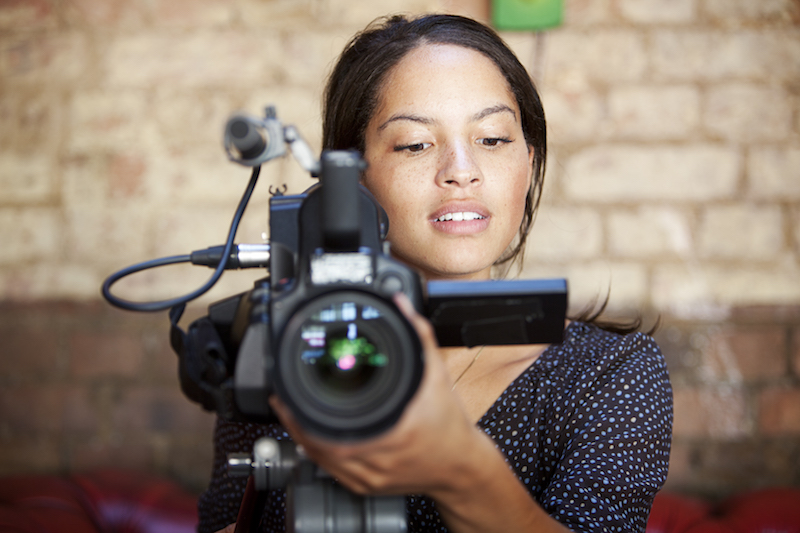 young woman with video camera