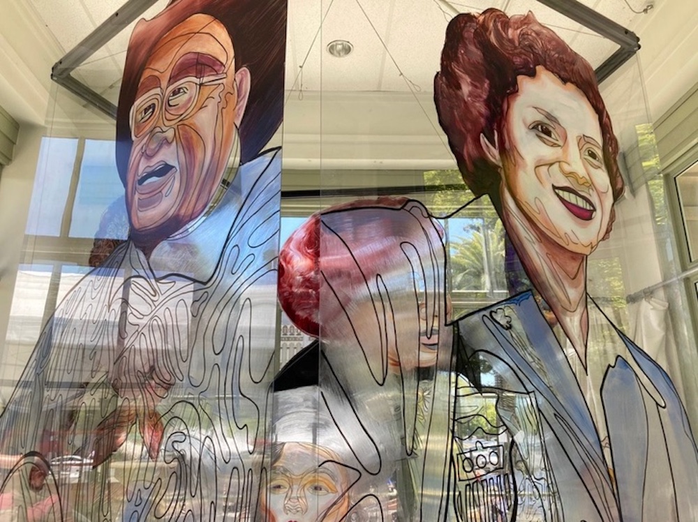 images on wall showing faces