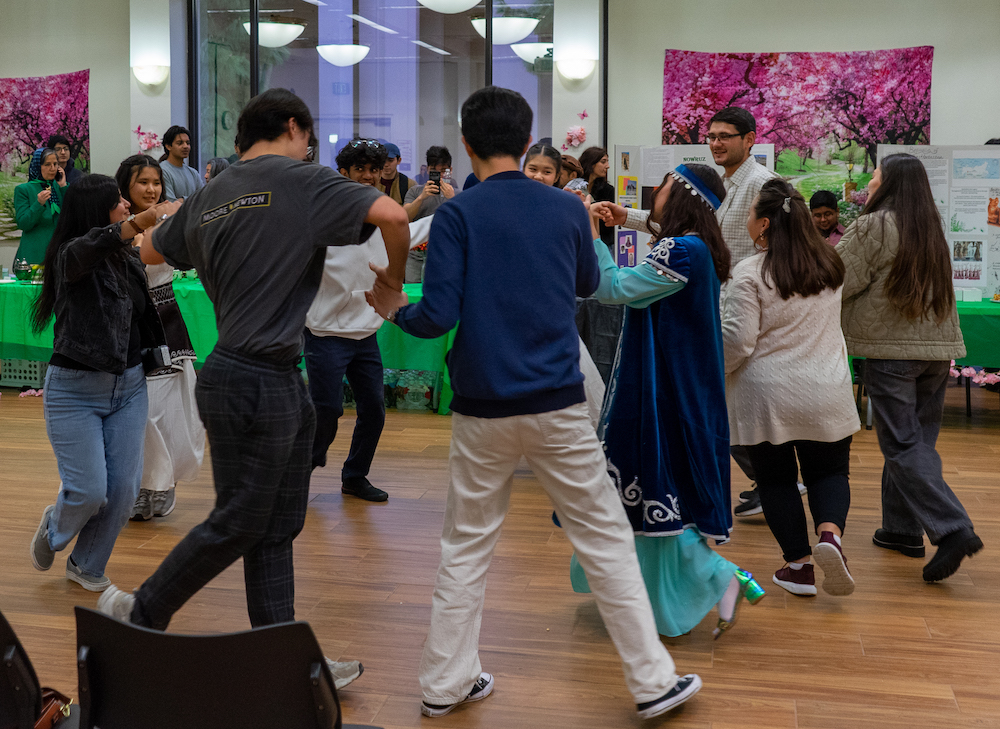 students dancing in circle