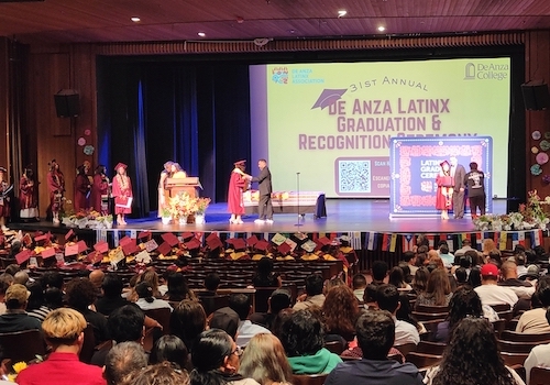 students on stage at Latinx Grad