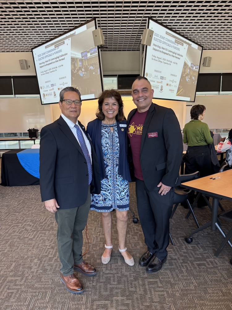 Lambert, Casas, Torres: two men smiling with a woman standing between them