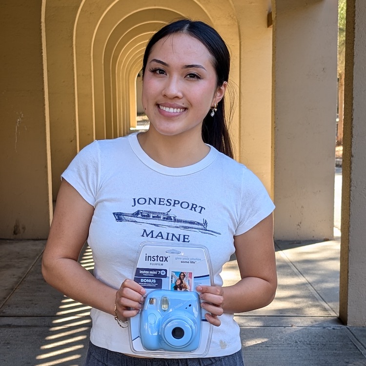 Audrey Lee holding camera